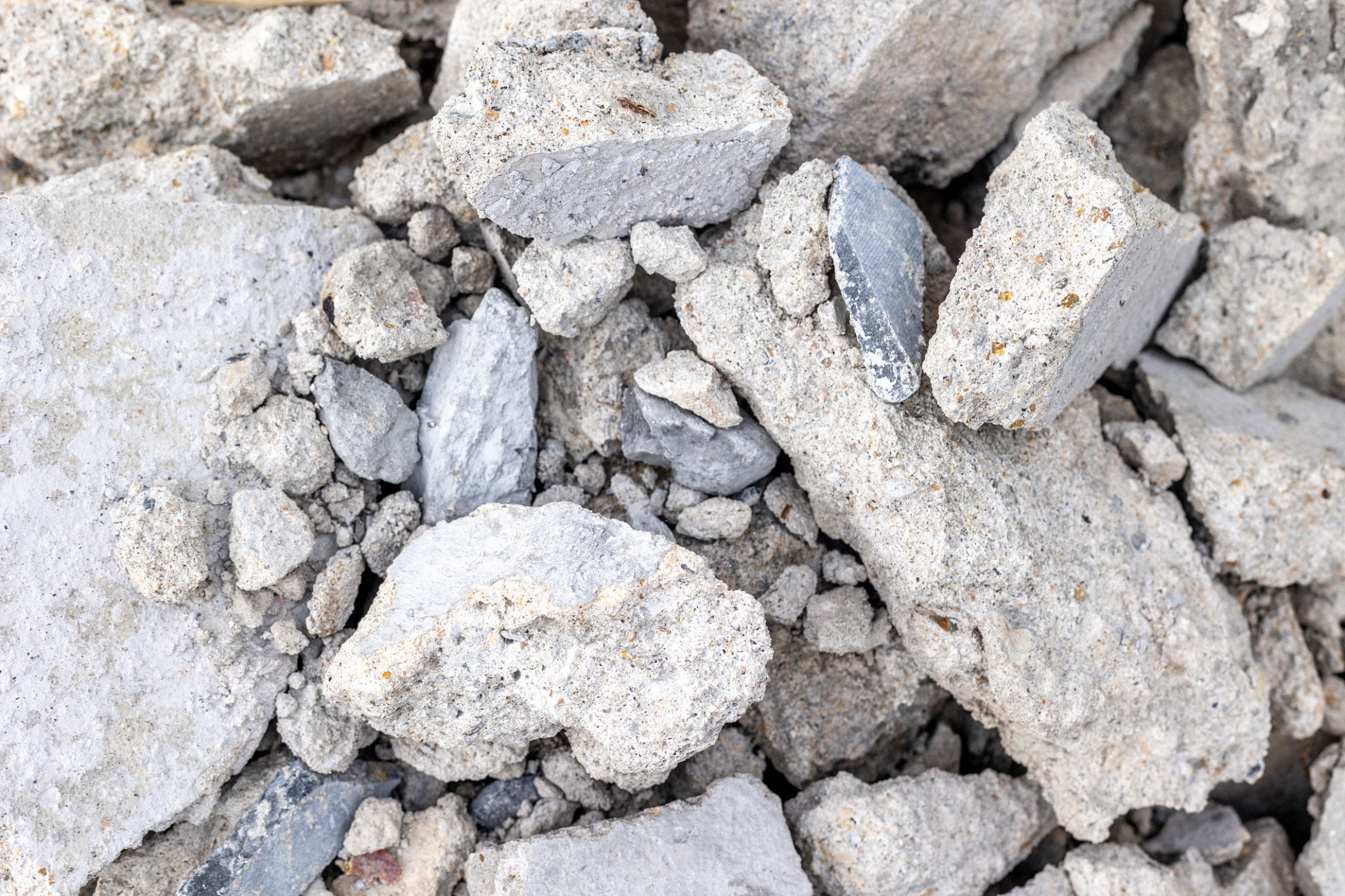 Clean concrete disposal rubble separated in a roll-off dumpster for aggregate recycling